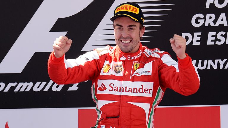 Fernando Alonso celebrates on the podium 
