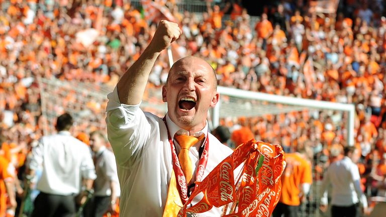 Blackpool's manager Ian Holloway celebrates with the trophy after his team beat Cardiff City during the 2010 Championship play-off final football match at Wembley Stadium in London on May 22, 2010. Blackpool won the game 3-2 to win promotion to the Premier League next season. AFP PHOTO / Adrian Dennis (Photo credit should read ADRIAN DENNIS/AFP/Getty Images)