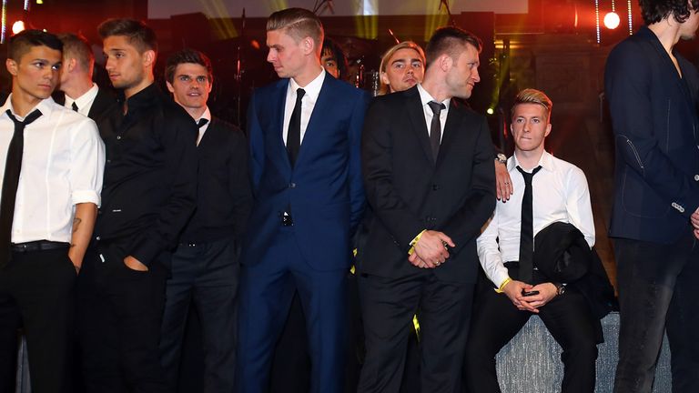 Marco Reus of Borussia Dortmund struggles to enjoy the party at the Natural History Museum after the Champions League final.