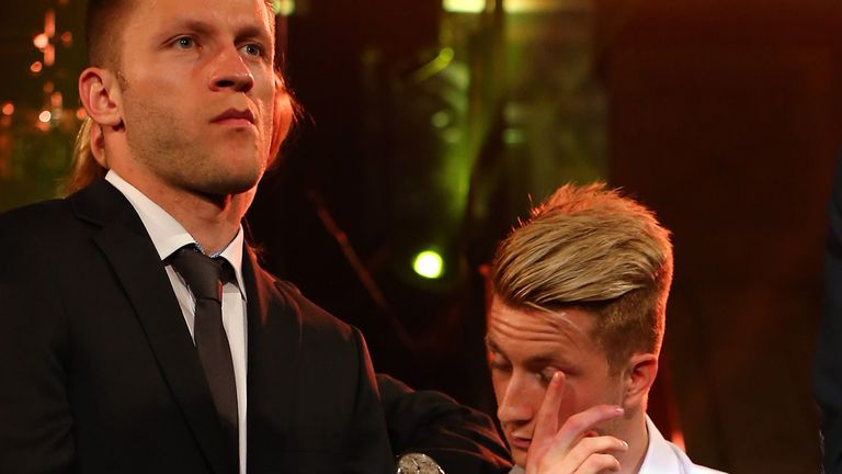 Marco Reus of Borussia Dortmund struggles to enjoy the party at the Natural History Museum after the Champions League final.