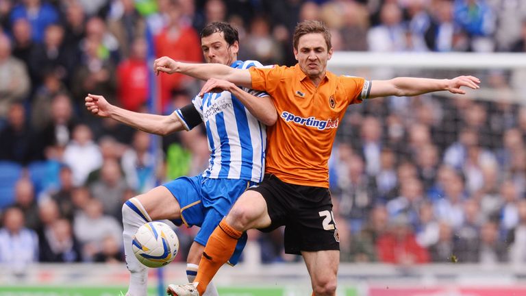 Gordon Greer of Brighton battles with Kevin Doyle of Wolves