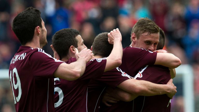Kevin McHattie is mobbed by team-mates after doubling Hearts' lead against St Mirren