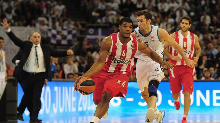Rudy Fernandez of Real Madrid tussles with Kyle Hines of Olympiacos Piraeus during the Turkish Airlines EuroLeague Final Four final.