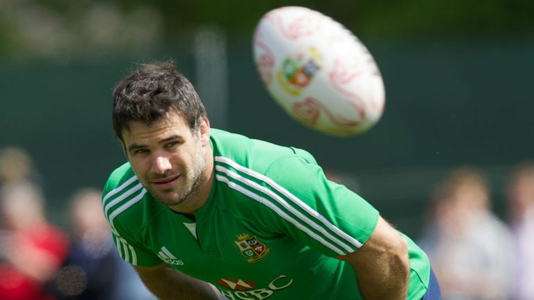 Mike Phillips of the British and Irish Lions keeps an eye on the ball