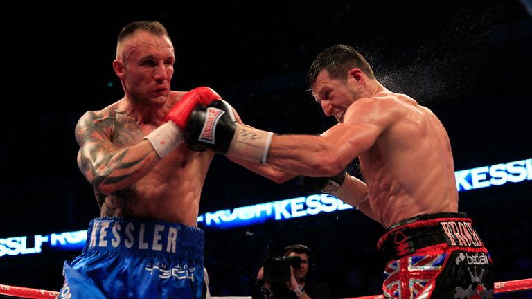 Mikkel Kessler and Carl Froch both land a punch during their super-middleweight fight at the O2 Arena in London