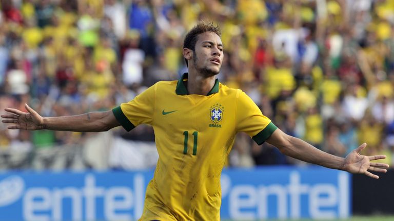 Brazilian national football team players Neymar celebrates after scoring against Bolivia during their friendly football match in Santa Cruz, Bolivia on April 6, 2013. AFP PHOTO/Aizar Raldes        (Photo credit should read AIZAR RALDES/AFP/Getty Images)