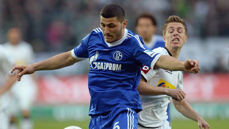 Moenchengladbach midfielder Patrick Herrmann and Schalke defender Sead Kolasinac vie for the ball 