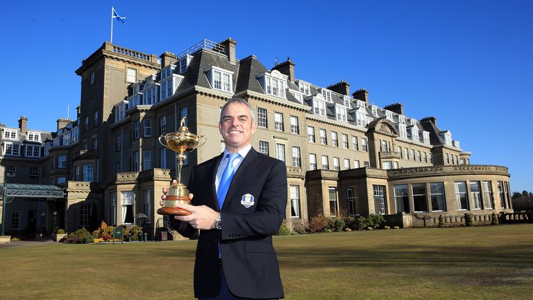 Paul McGinley of Ireland the 2014 European Ryder Cup Team Captain with the Ryder Cup outside and the BMW Official Cars of the Ryder Cup in front of the Gleneagles Hotel