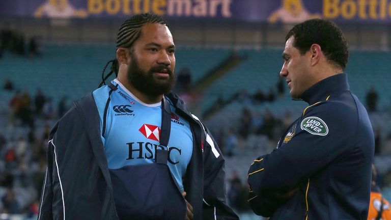 Tatafu Polota-Nau and George Smith speak on the field after Super Rugby match between Waratahs and Brumbies at ANZ Stadium