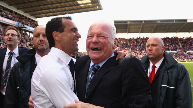 Dave Whelan, Chairman of Wigan Athletic and manager Roberto Martinez celebrate after winning 1-0 to keep them in the Premier League. 2011