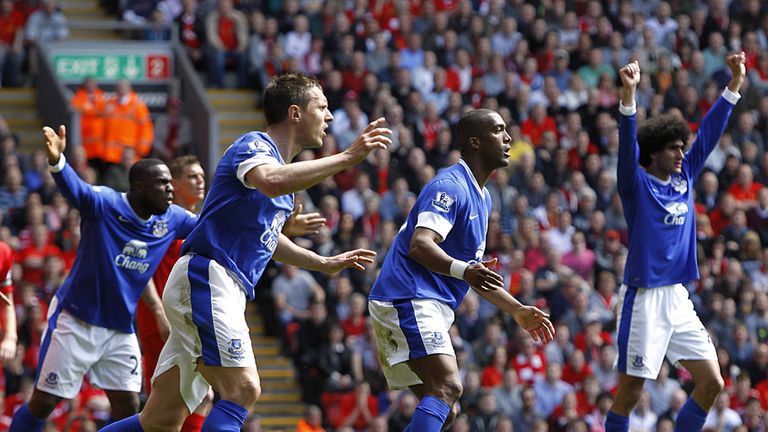 Everton's Sylvain Distin and his team-mates react after he has a goal disallowed