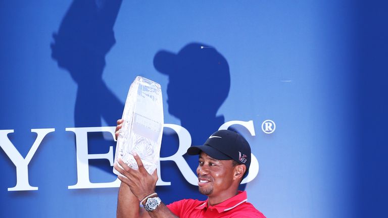 Tiger Woods  holds the winner's trophy after the final round of the Players Championship at TPC Sawgrass.