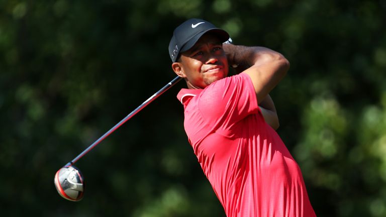 Tiger Woods plays a shot from the 11th tee during the final round of the Players Championship at TPC Sawgrass.