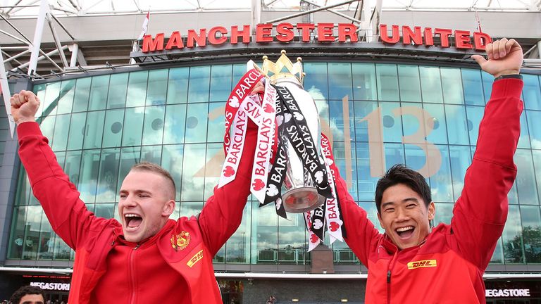 Tom Cleverley and Shinji Kagawa of Manchester United pose with the Premier League trophy 