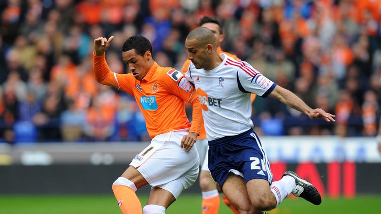 Blackpool's Tom Ince battles for the ball with Bolton's  Darren Pratley 