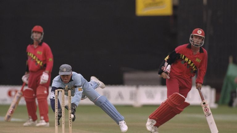 Alec Stewart of England runs out Andy Waller of Zimbabwe during the third one day international between Zimbabwe and England in Harare, Zimbabwe
