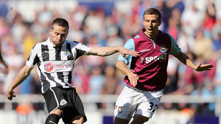  Yohan Cabaye of Newcastle crosses the ball under pressure from Gary O'Neil of West Ham