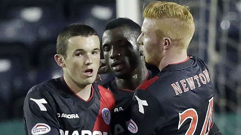 Conor Newton (R) celebrates a St Mirren goal with Esmael Goncalves and John McGinn