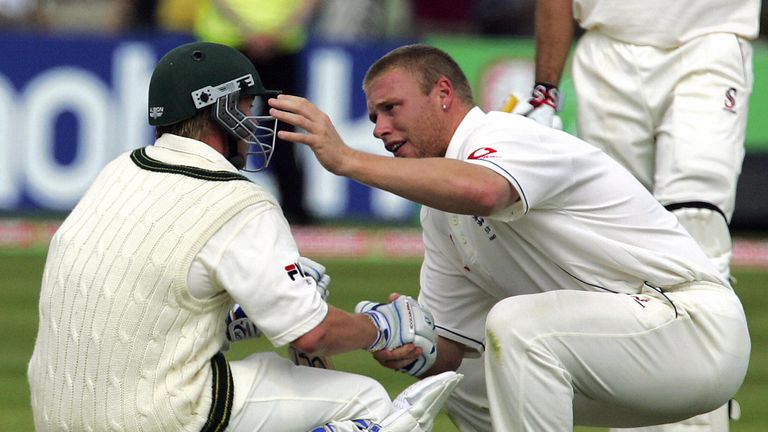 Birmingham, UNITED KINGDOM:  Englands Andrew Flintoff (R) consoles Australian Brett Lee after England beat Australia by just two runs to win the Second Test at Edgbaston cricket ground in Birmingham 07 August 2005. The Series is now drawn at 1-1 and resumes on 11 August at Old Trafford in Manchester. AFP PHOTO/ALESSANDRO ABBONIZIO  (Photo credit should read Alessandro Abbonizio/AFP/Getty Images)