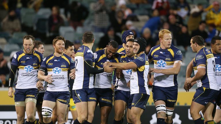  Tevita Kuridrani of the Brumbies celebrates with teammates after scoring a try against the Lions