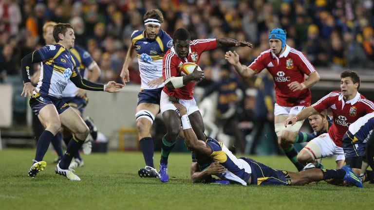Christian Wade of the Lions is tackled during the International tour match against the Brumbies
