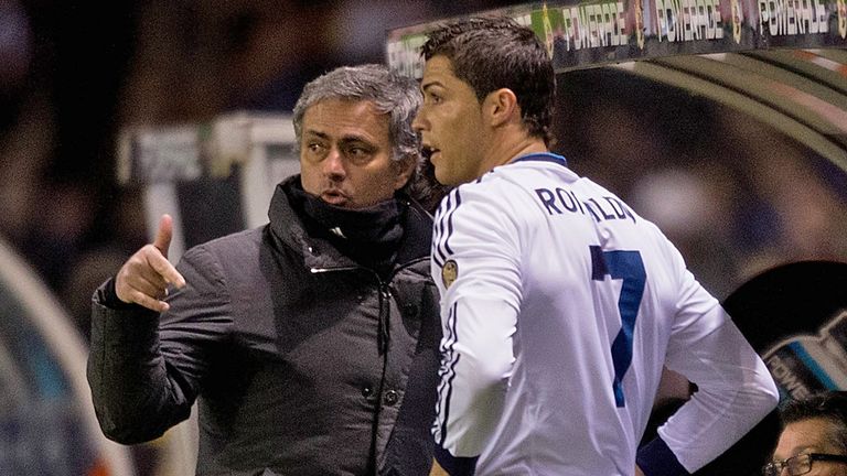 LA CORUNA, SPAIN - FEBRUARY 23:  Head coach Jose Mourinho (L) of Real Madrid CF gives instructions to Cristiano Ronaldo (2ndl) on the desk during the La Liga match between RC Deportivo La Coruna and Real Madrid CF at Riazor Stadium on February 23, 2013 in La Coruna, Spain.  (Photo by Gonzalo Arroyo Moreno/Getty Images)