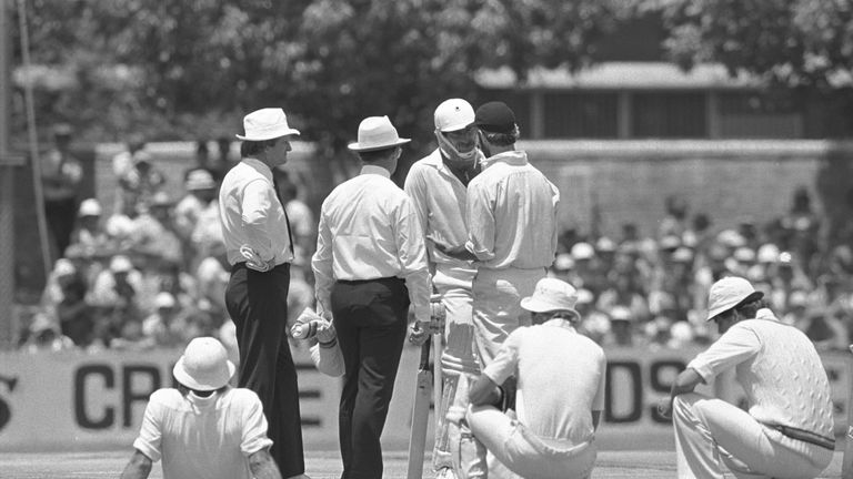 Australian fast bowler Dennis Lillee talks to England captain Mike Brearley about Lillee's aluminium bat. Lillee eventually uses a traditional wooden bat.  Australia v England 1st Test at Perth.