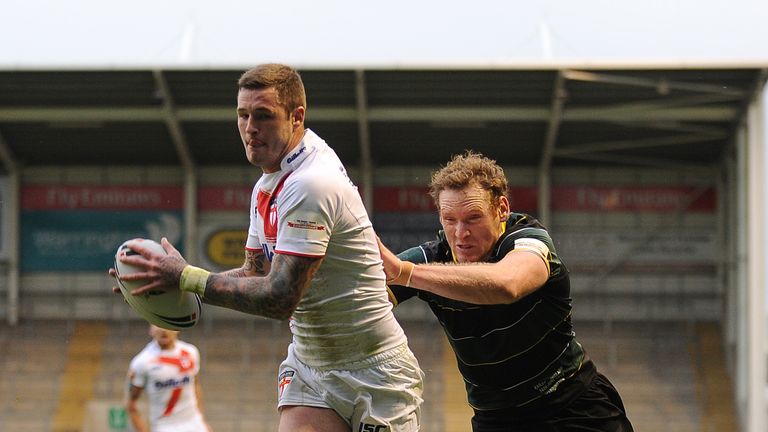 Exile's Joel Monaghan fails to stop England's Zak Hardaker from scoring the opening try during the international origin match at the Halliwell Jones Stadium