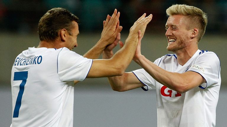 LEIPZIG, GERMANY - JUNE 05:  Andre Schurrle (R) of 'World Team' celebrates after scoring his team's third goal with team mate Andrij Shevshenko (L) during the Michael Ballack farewell match at Red Bull Arena on June 5, 2013 in Leipzig, Germany.  (Photo by Boris Streubel/Bongarts/Getty Images)