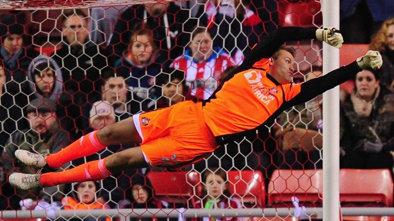SUNDERLAND, ENGLAND - DECEMBER 11:  Sunderland keeper Simon Mignolet produces a diving stop during the Barclays Premier League match between Sunderland and Reading at Stadium of Light on December 11, 2012 in Sunderland, England.  (Photo by Stu Forster/Getty Images)