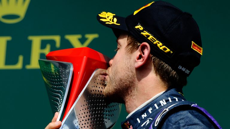 Sebastian Vettel kisses the trophy