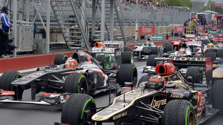 The cars queue up at the end of the pit lane