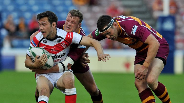 St Helens' Gareth O'Brien is tackled by Huddersfield Giants' Danny Brough and Shaun Lunt (right) 