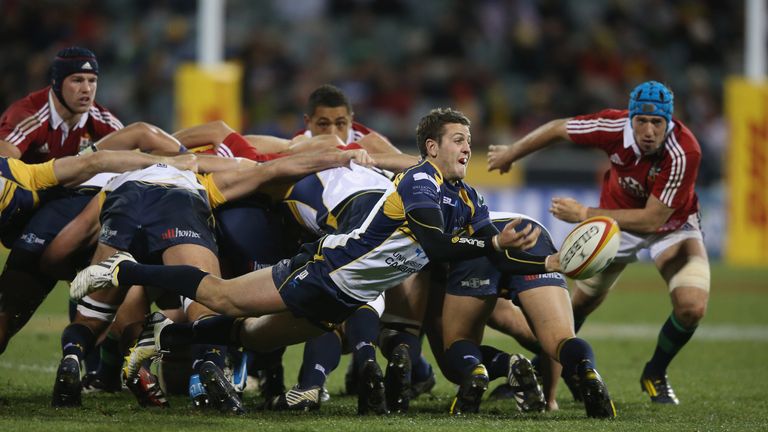 Ian Prior of the Brumbies passes the ball during the International tour match against the British & Irish Lions