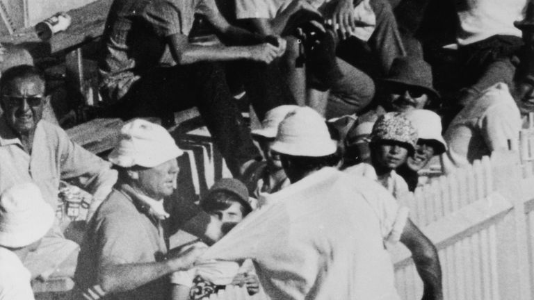 England bowler John Snow is grabbed by a member of the crowd after Australian batsman Terry Jenner had been hit on the head by one of his 'bumper' balls during the Final Test match in Sydney, 20th February 1971.