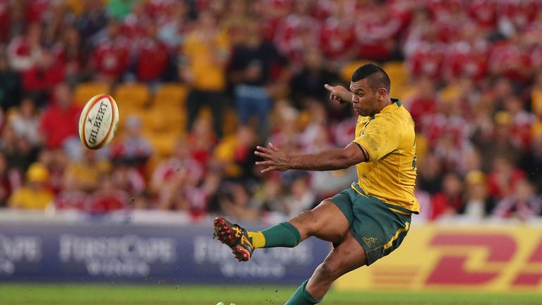 Kurtley Beale of Australia slips while kicking for goal during the first Test against the Lions