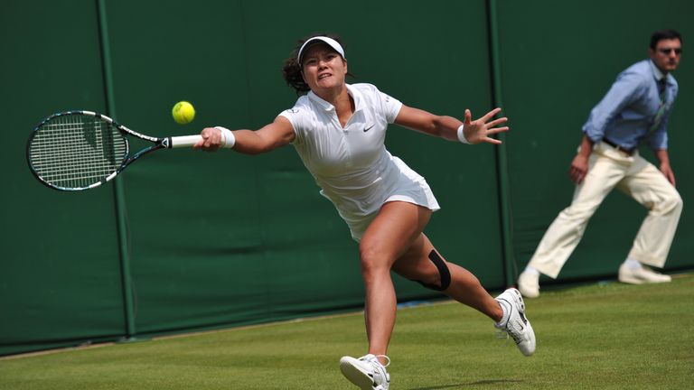 China's Li Na reaches for a return against Michaella Krajicek during their women's first round match on day two of the 2013 Wimbledon Championships tennis tournament at the All England Club in Wimbledon, southwest London, on June 25, 2013