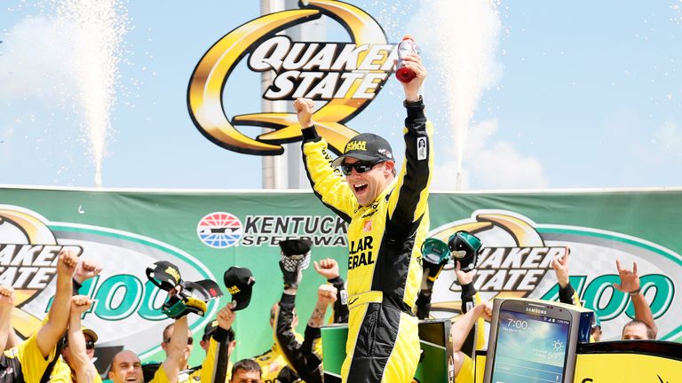 Matt Kenseth, driver of the #20 Dollar General Toyota, celebrates in Victory Lane after winning the NASCAR Sprint Cup Series Quaker State 400 at Kentucky Speedway on June 30, 2013 in Sparta, Kentucky