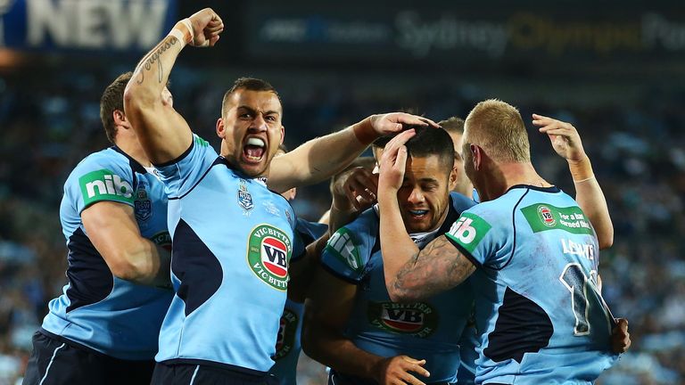 Blake Ferguson, Jarryd Hayne and Luke Lewis celebrate a try by Jarryd Hayne during game one of the ARL State of Origin series between the New South Wales Blues and the Queensland Maroons