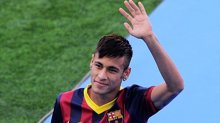 FC Barcelona's new player Brazilian Neymar da Silva Santos Junior waves during his presentation at Camp Nou stadium in Barcelona, on June 3, 2013. Santos and Brazil star Neymar signed a five-year contract with Spanish giants Barcelona. AFP PHOTO/ JOSEP LAGO        (Photo credit should read JOSEP LAGO/AFP/Getty Images)