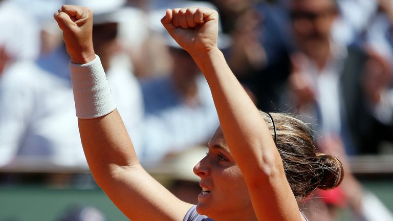 Italy's Sara Errani celebrates after winning against Poland's Agnieszka Radwanska in their French Open quarter final match at the Roland Garros