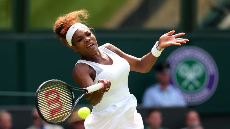 Serena Williams of the United States of America plays a forehand during her Ladies' Singles first round match against Mandy Minella of Luxembourg on day two of the Wimbledon Lawn Tennis Championships at the All England Lawn Tennis and Croquet Club on June 25, 2013 in London, England