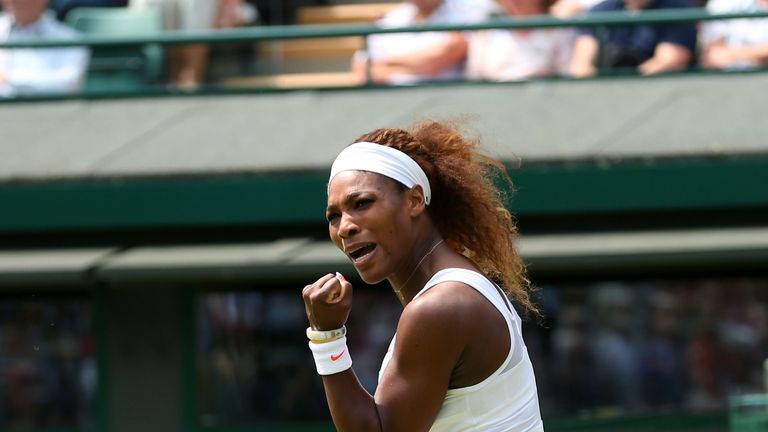 Serena Williams  celebrates a point during a second round match against Caroline Garcia at Wimbledon