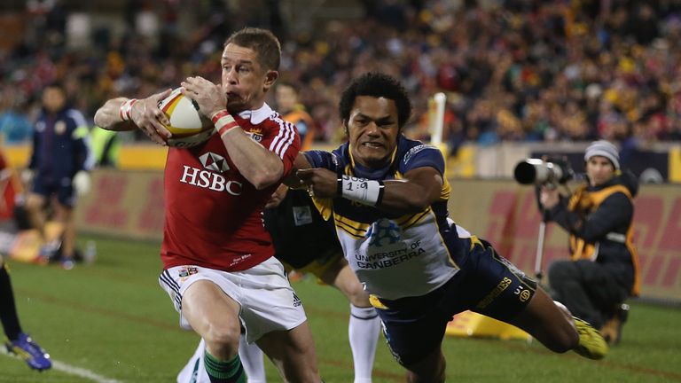 Shane Williams of the Lions is tackled by Henry Speight of the ACT Brumbies at Canberra Stadium