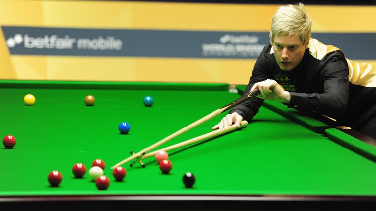 Neil Robertson in action during his first round match against Robert Milkins during the Betfair World Snooker Championship at the Crucible Theatre