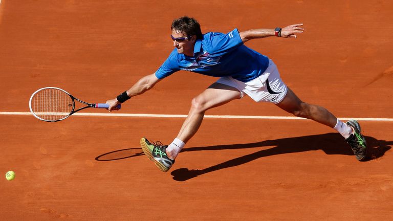 Spain's Tommy Robredo returns to David Ferrer during their French Open quarter-final