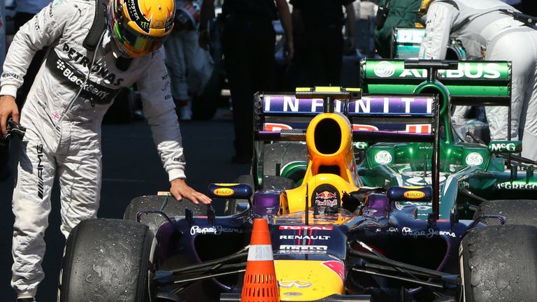 Hamilton checks the tyres on the race-winning Red Bull