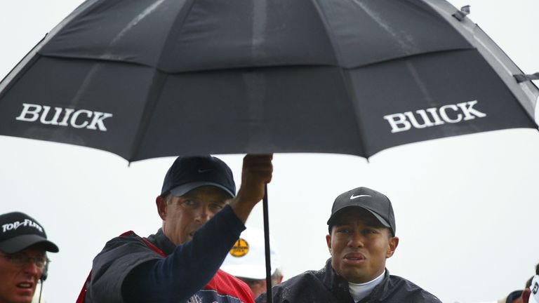 Tiger Woods shelters during round three of the 2002 Open Championship at Muirfield