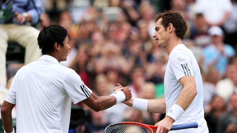 LONDON, ENGLAND - JUNE 26:  Andy Murray of Great Britain shakes hands at the net with Lu Yen-Hsun of Taipei after their Gentlemen's Singles second round match on day three of the Wimbledon Lawn Tennis Championships at the All England Lawn Tennis and Croquet Club on June 26, 2013 in London, England.  (Photo by Clive Brunskill/Getty Images)