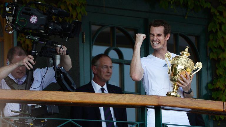 Andy Murray celebrates with the Wimbledon trophy
